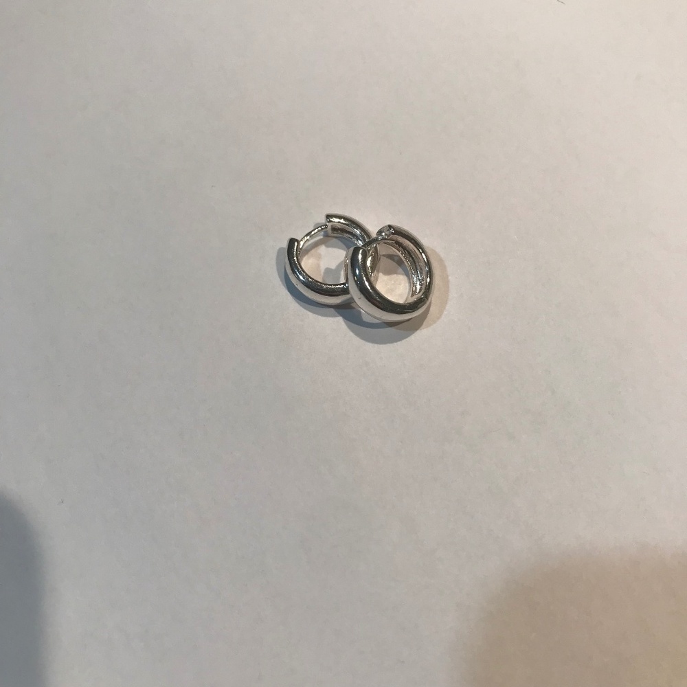 Silver coloured Huggie earrings